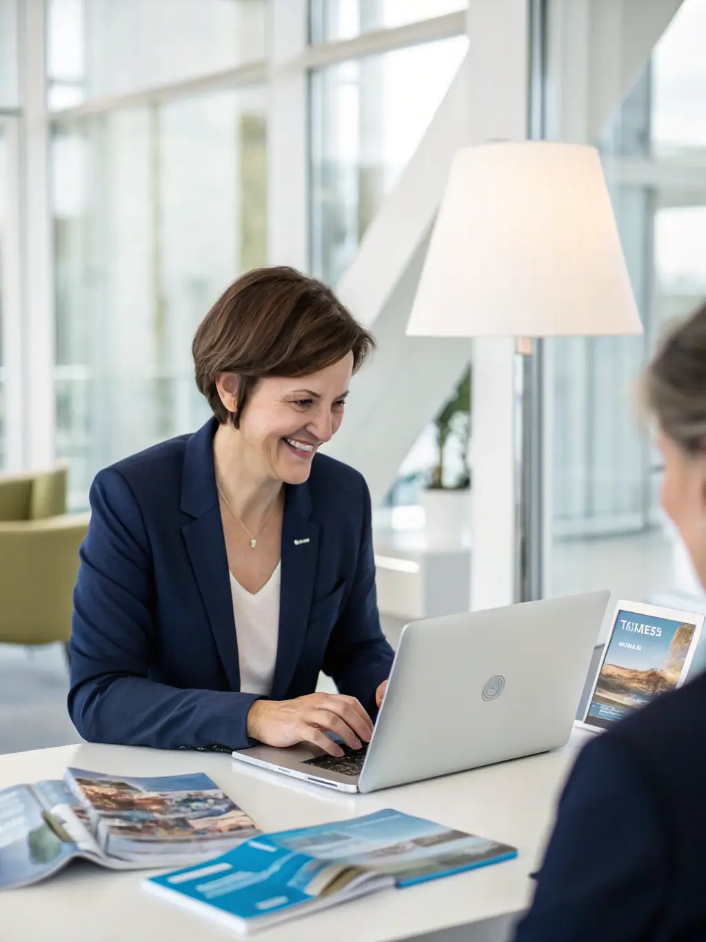 A personal assistant helping a client with travel arrangements, illustrating OrderandDrive's personalized concierge services.